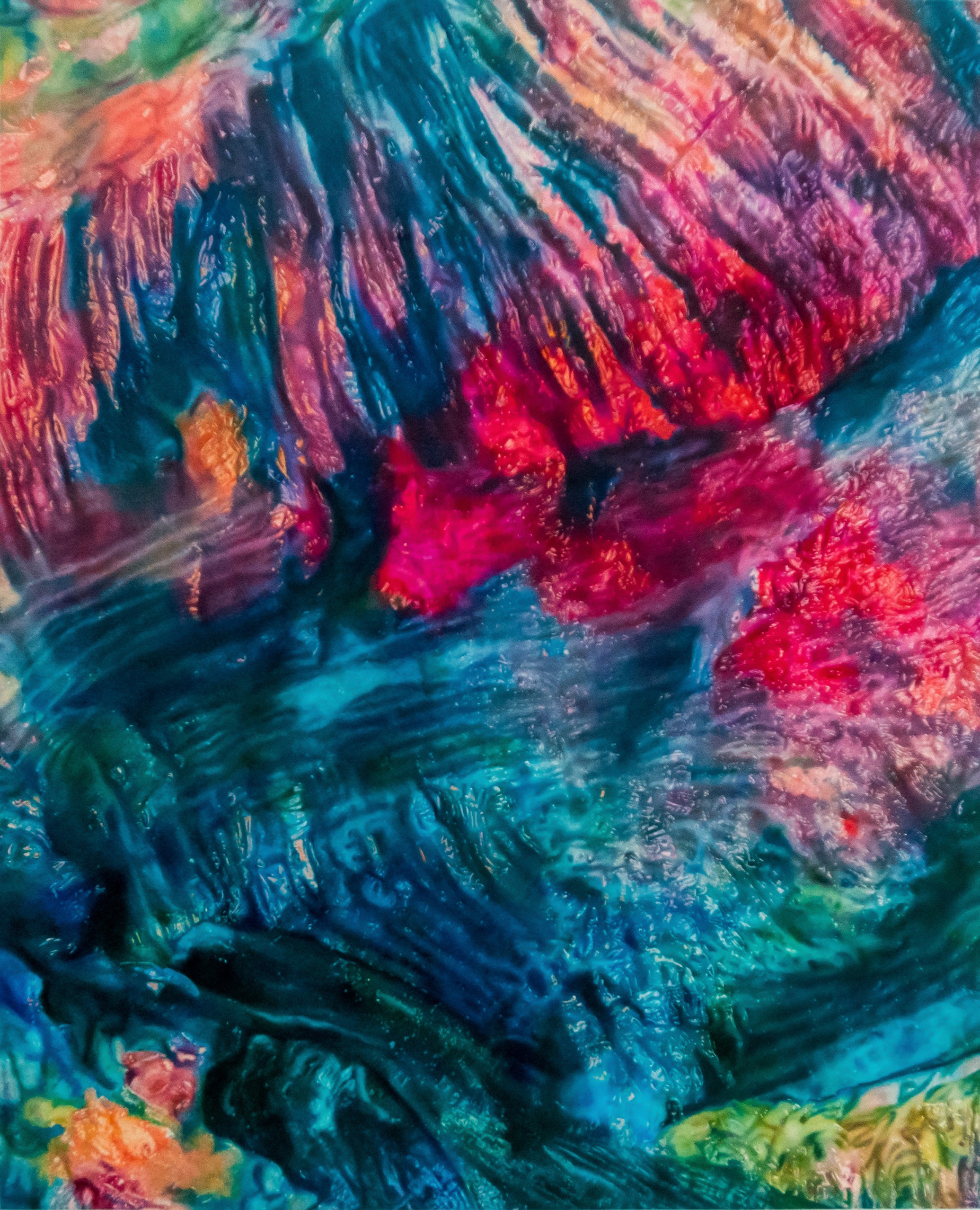 Close-up of a vibrant abstract painting with swirling patterns in blue, red, purple, and green hues.