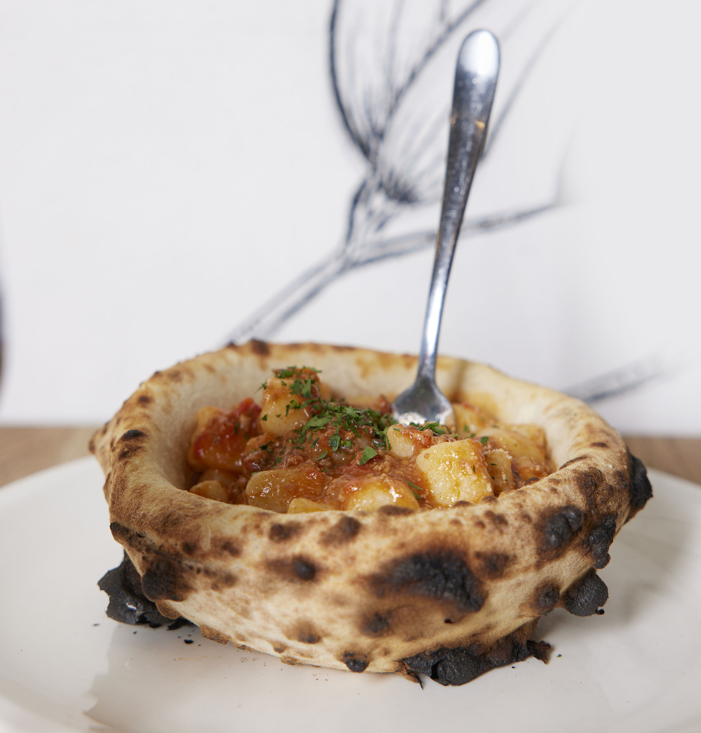 Pasta in a Pizza Bowl, served in an edible handcrafted woodfired pizza bowl