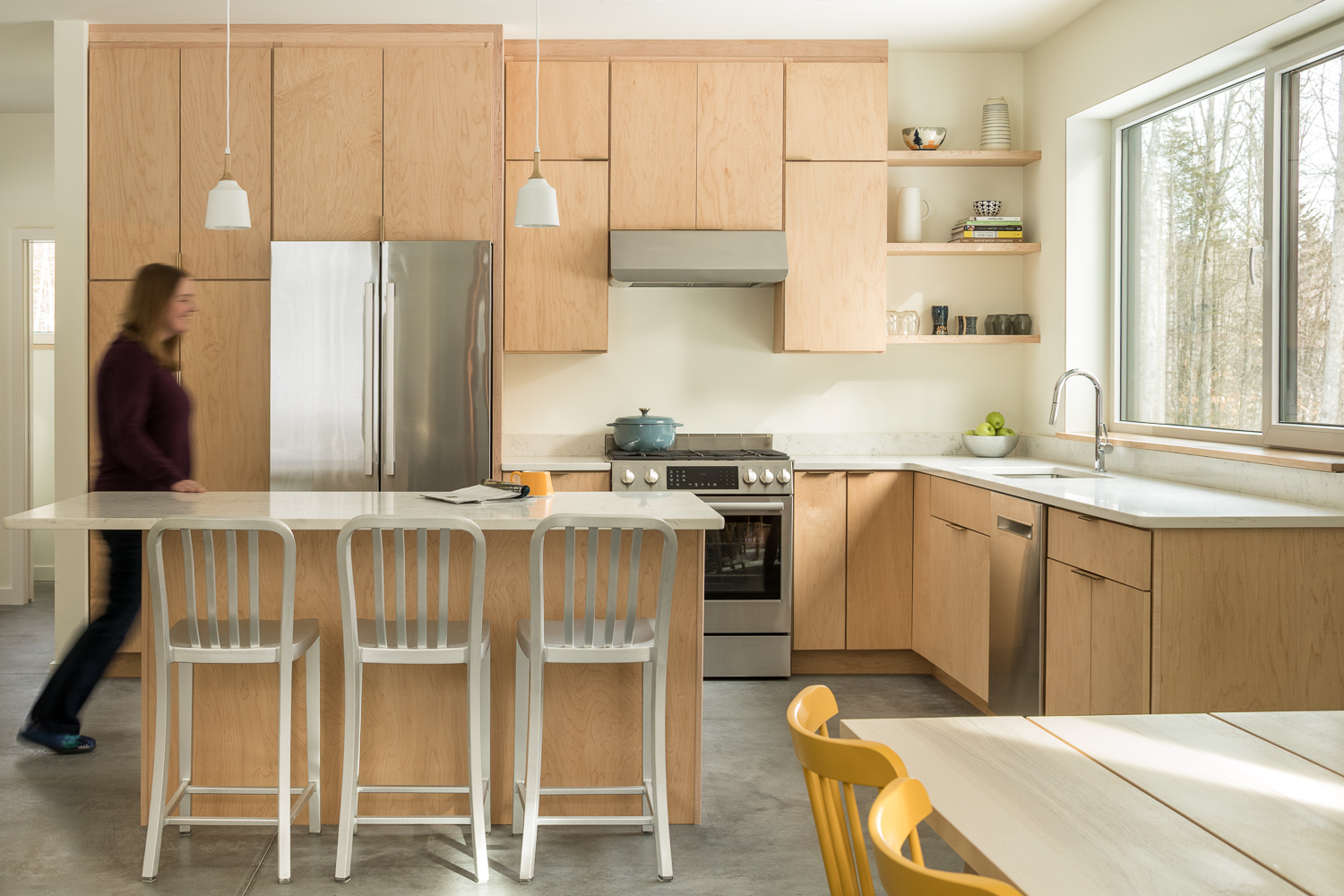 Kevin Browne's modern Maine home kitchen with light wood cabinetry