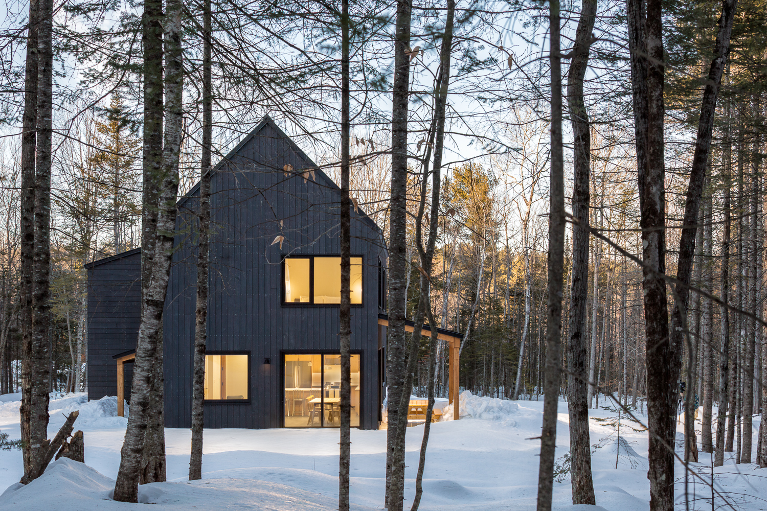 Kevin Browne's modern Maine home nestled in snowy forest architecture