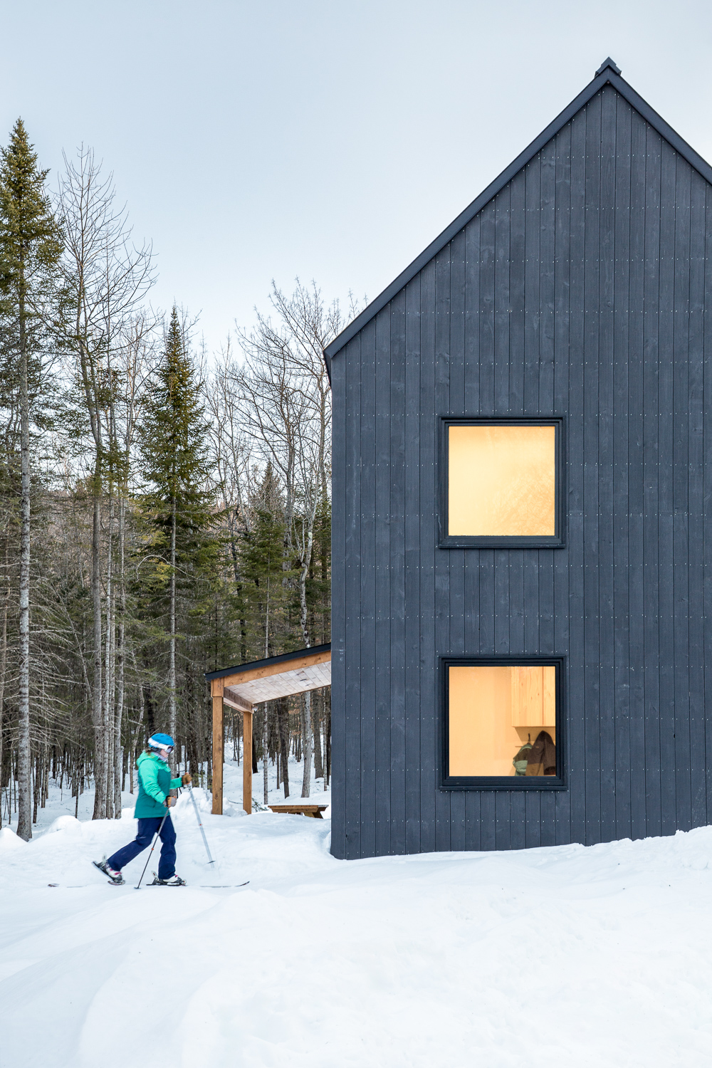 Kevin Browne's Maine home: modern architecture nestled in snowy forest landscape