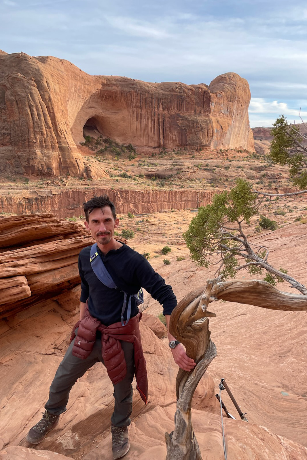 Person standing with red canyons in background