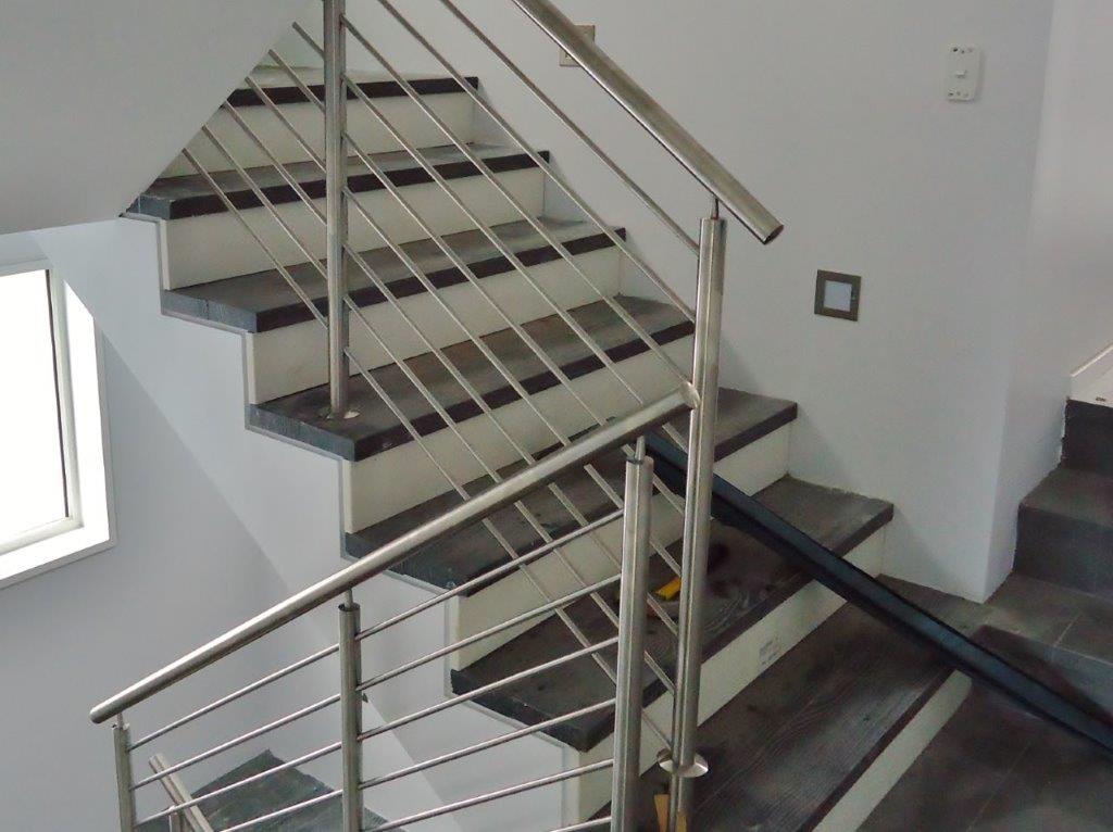 Stainless steel post and rail balustrade on an internal staircase