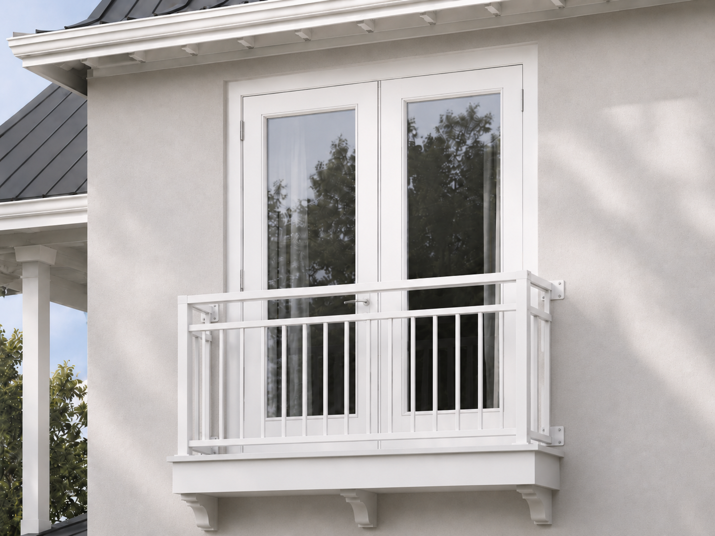 White metal Juliet balcony with vertical bars attached to a light-colored house wall with double glass doors.