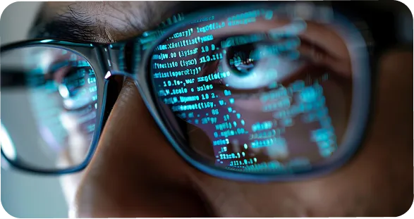 Close-up of coding on glasses and expert discussing Vibe Code development services