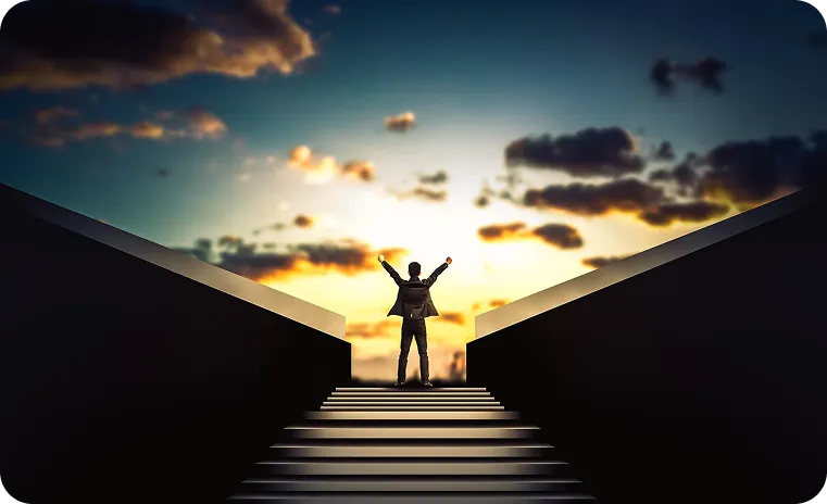 Person celebrating success at sunrise, symbolizing blockchain project growth.