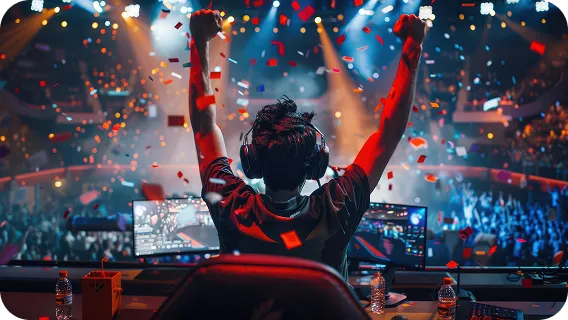Gamer celebrating victory on stage with screens behind using ai agent app