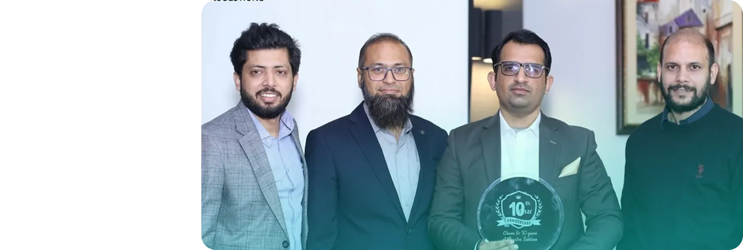 Phaedra Solutions CEO and cofounders holding a company milestone award
