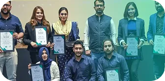 Phaedra Solutions employees holding excellence award certificates