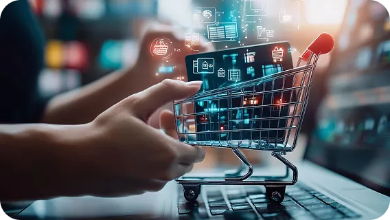 Miniature shopping cart on an open laptop highlighting custom ecommerce software