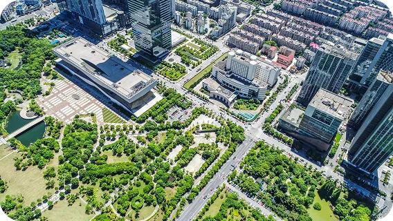Aerial view of a city grid and green parks for real estate AI MVP models