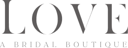 Logo with the word LOVE in large letters and the text A Bridal Boutique below.