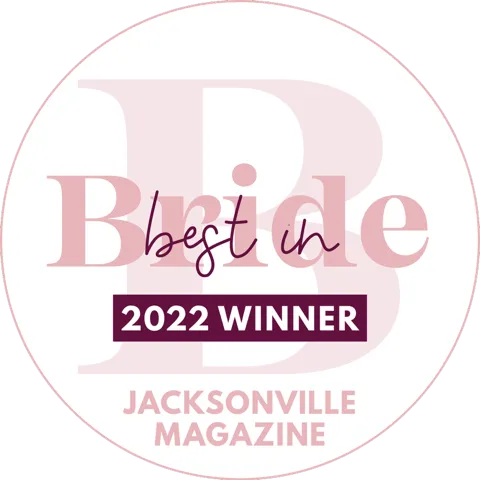 Circular emblem with text 'Best in Bride 2022 Winner' and 'Jacksonville Magazine'.