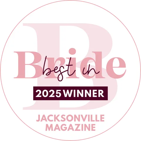 Best in Bride 2025 Winner badge from Jacksonville Magazine with a large pink letter B background.