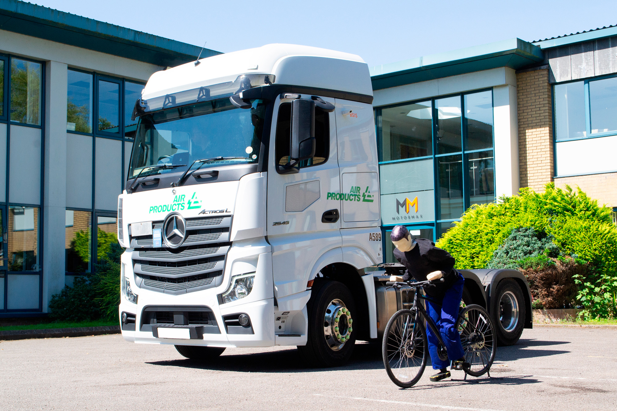 A Motormax® cyclist detection test in action outside their UK HQ, demonstrating advanced fleet safety technology installed on an Air Products Mercedes Actros vehicle.