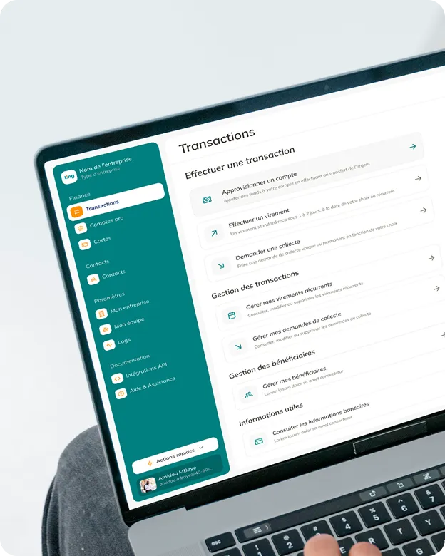 Écran d'ordinateur portable affichant un tableau de bord d'application financière avec un menu latéral contenant des sections comme Transactions, Comptes pro, Cartes, Contacts, Paramètres, Documentation. La section Transactions active présente des options pour effectuer une transaction : approvisionner un compte, effectuer un virement, demander une collecte, gérer virements récurrents, demandes de collecte, bénéficiaires, et consulter informations bancaires.