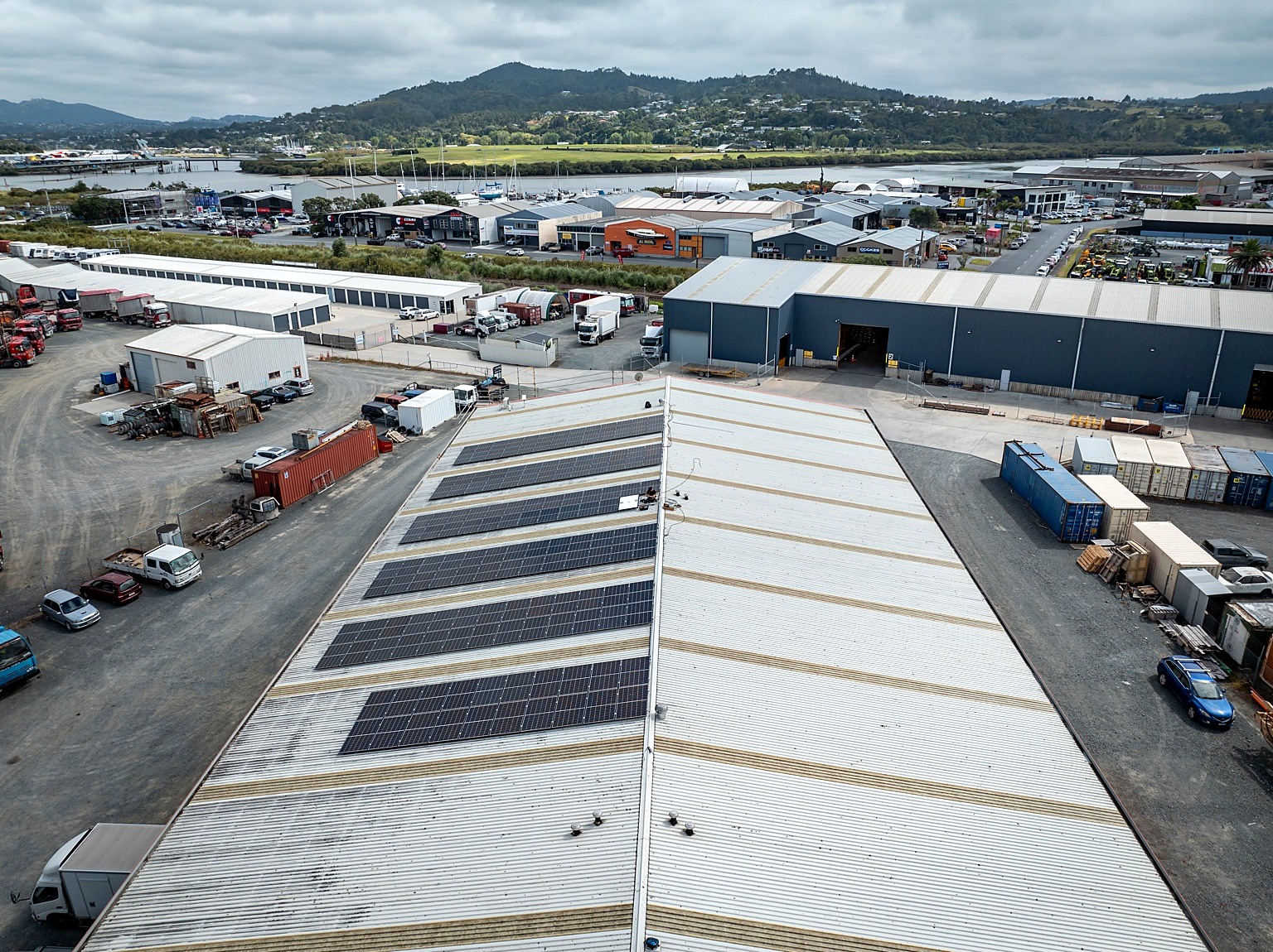 Wide aerial view of a commercial solar rooftop installation