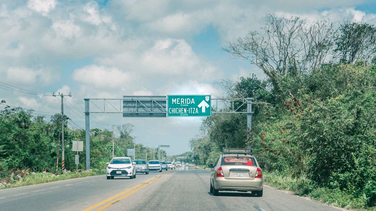Road sign to Mérida, Mexico on highway in Mexico