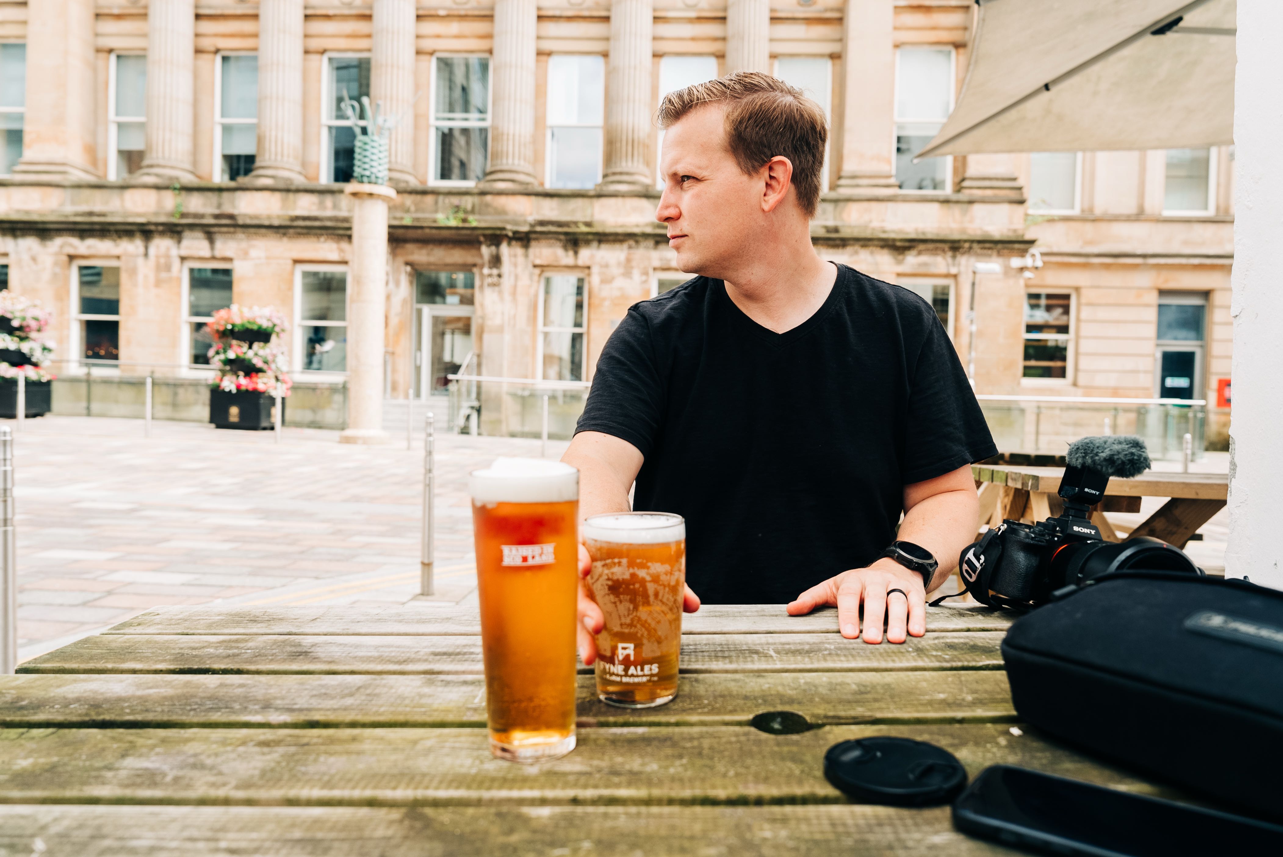 Chris and his beer enjoying a patio in Glasgow, Scotland