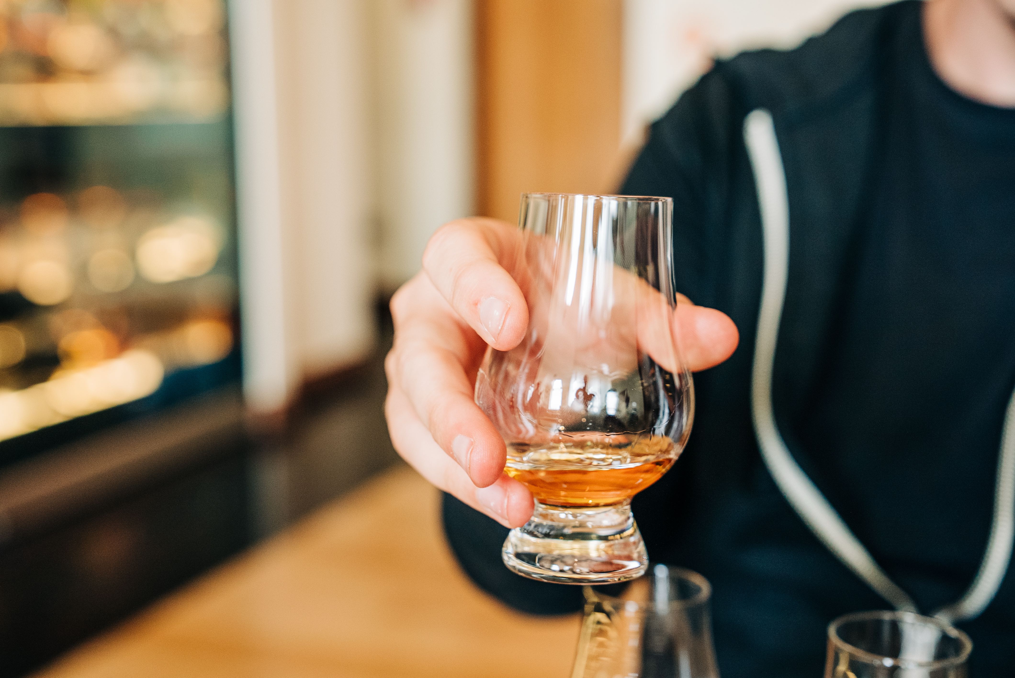 Chris holding his taste of whisky