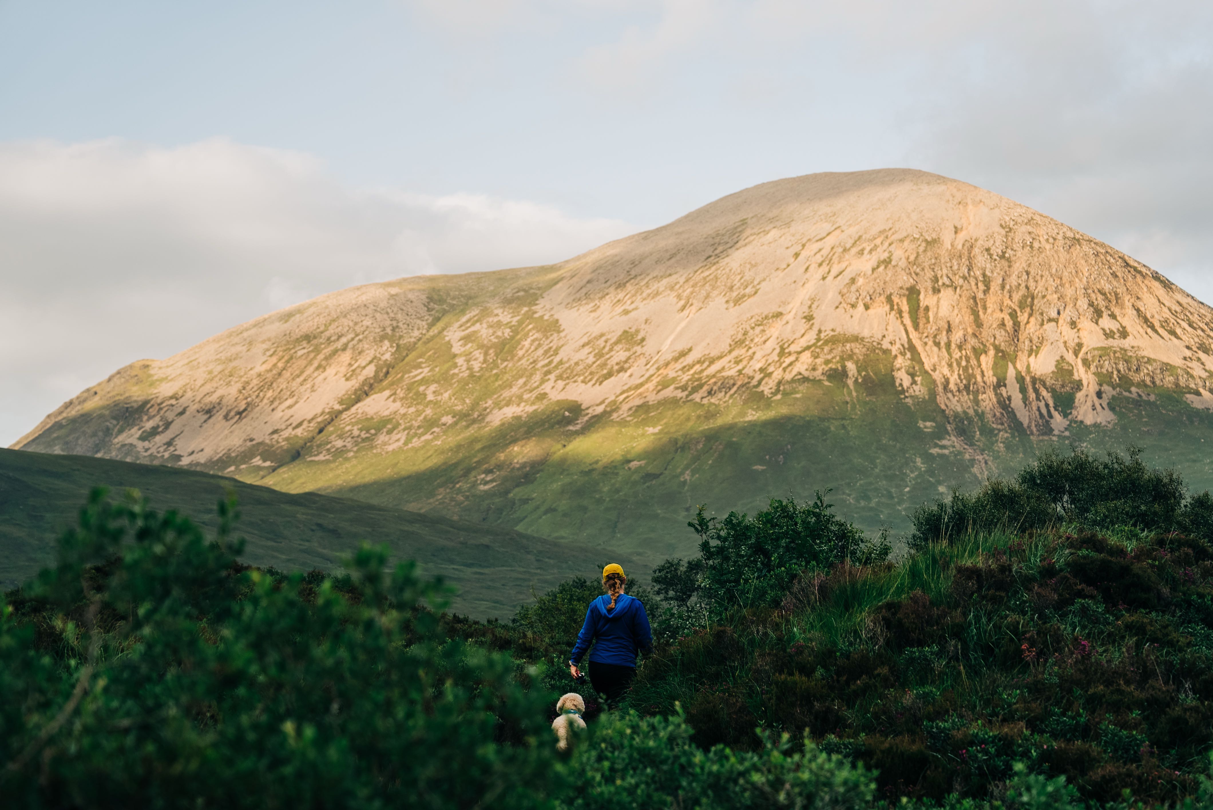 Girl and dog beginning the hike up Sgùrr Alsdair