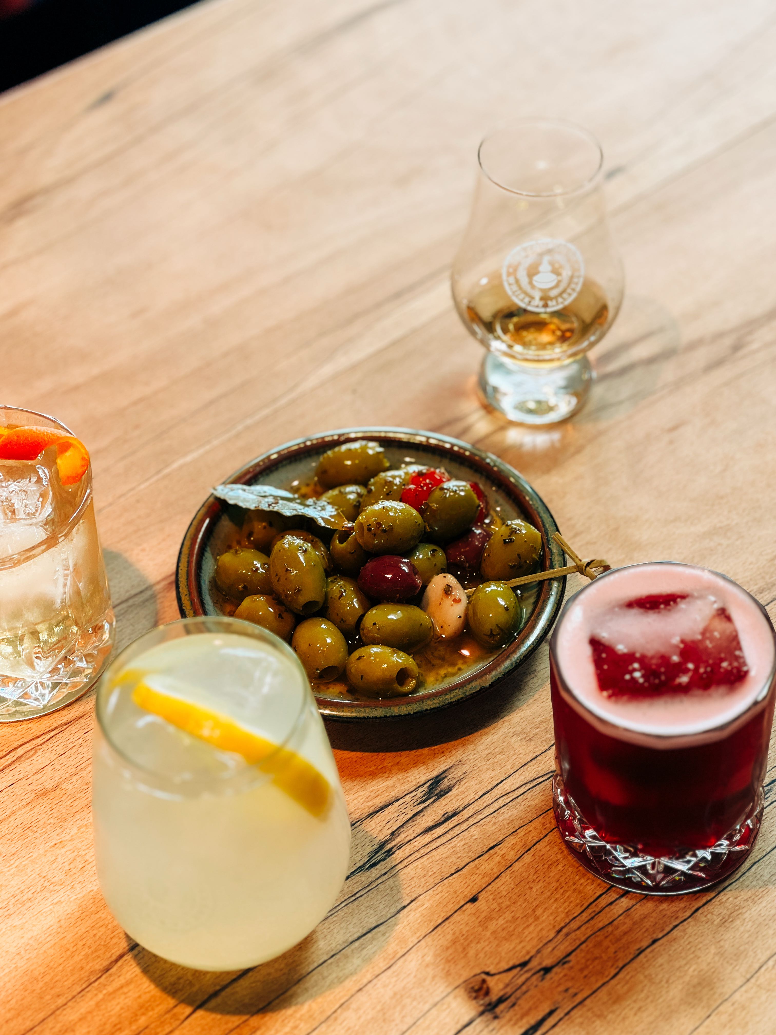Drinks and olives at Raasay Distillery, Scotland