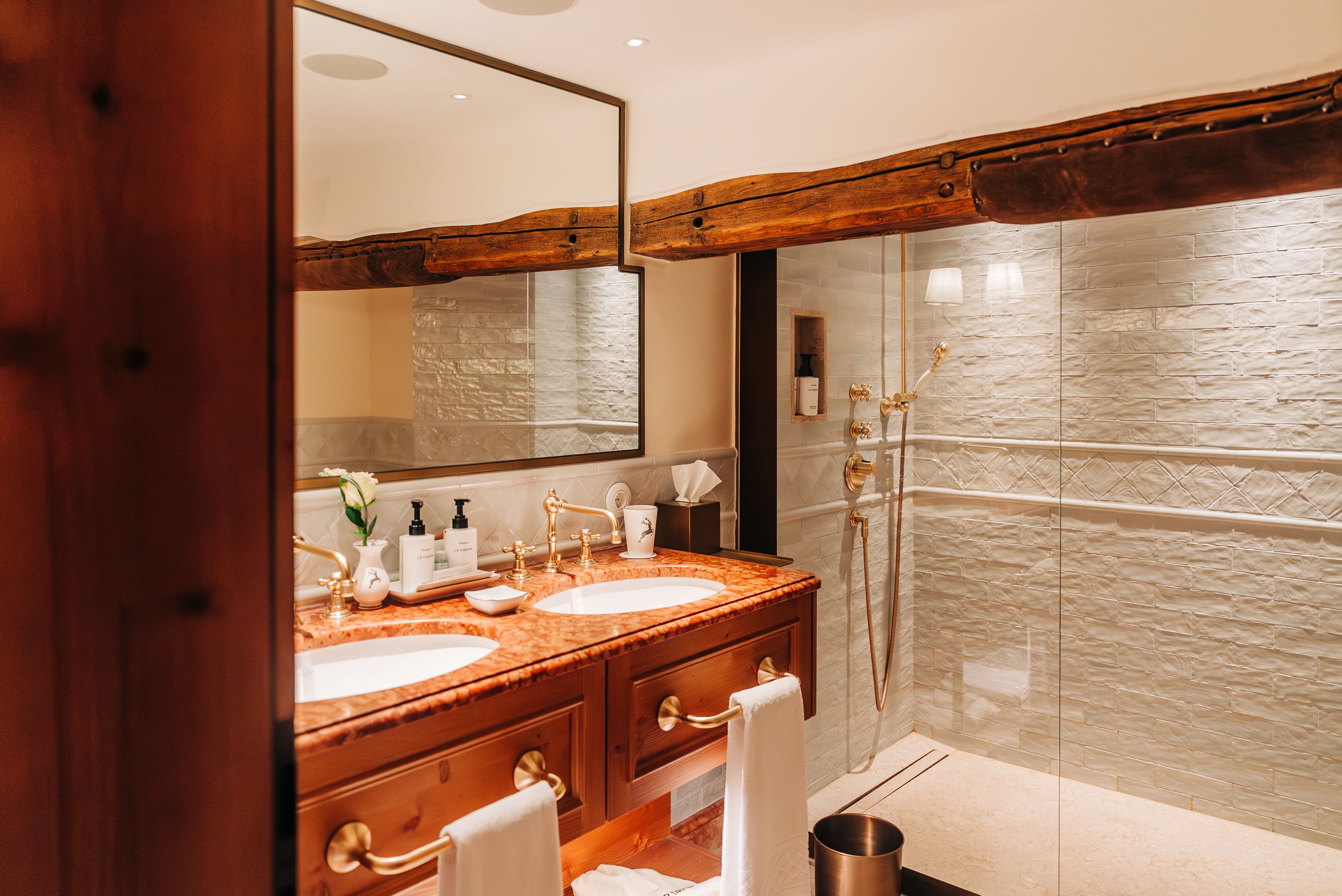 Double vanity and shower in a junior suite at Hotel Goldener Hirsch, Salzburg, Austrial