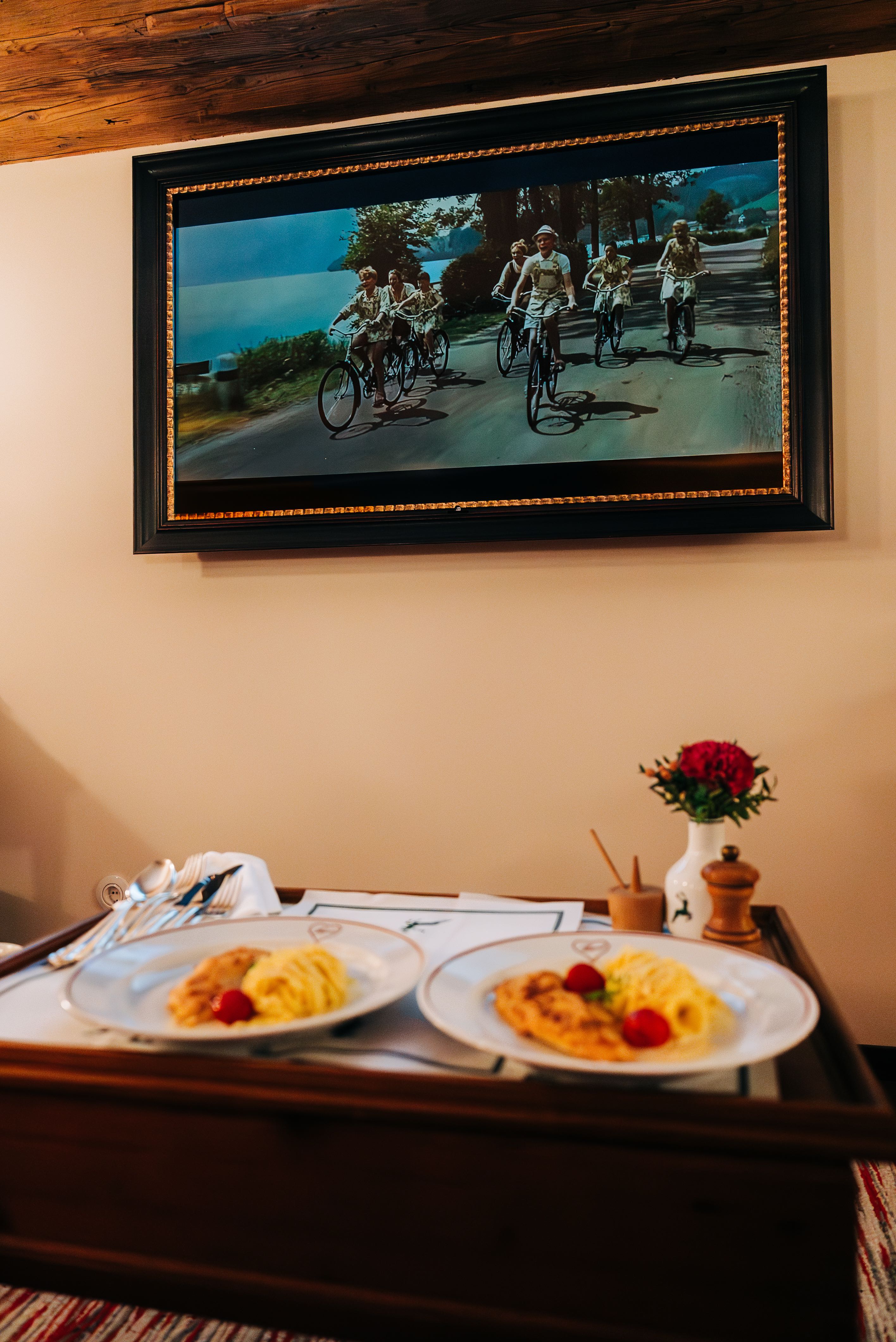 Dinner of schnitzel with noodles while watching The Sound of Music in our room