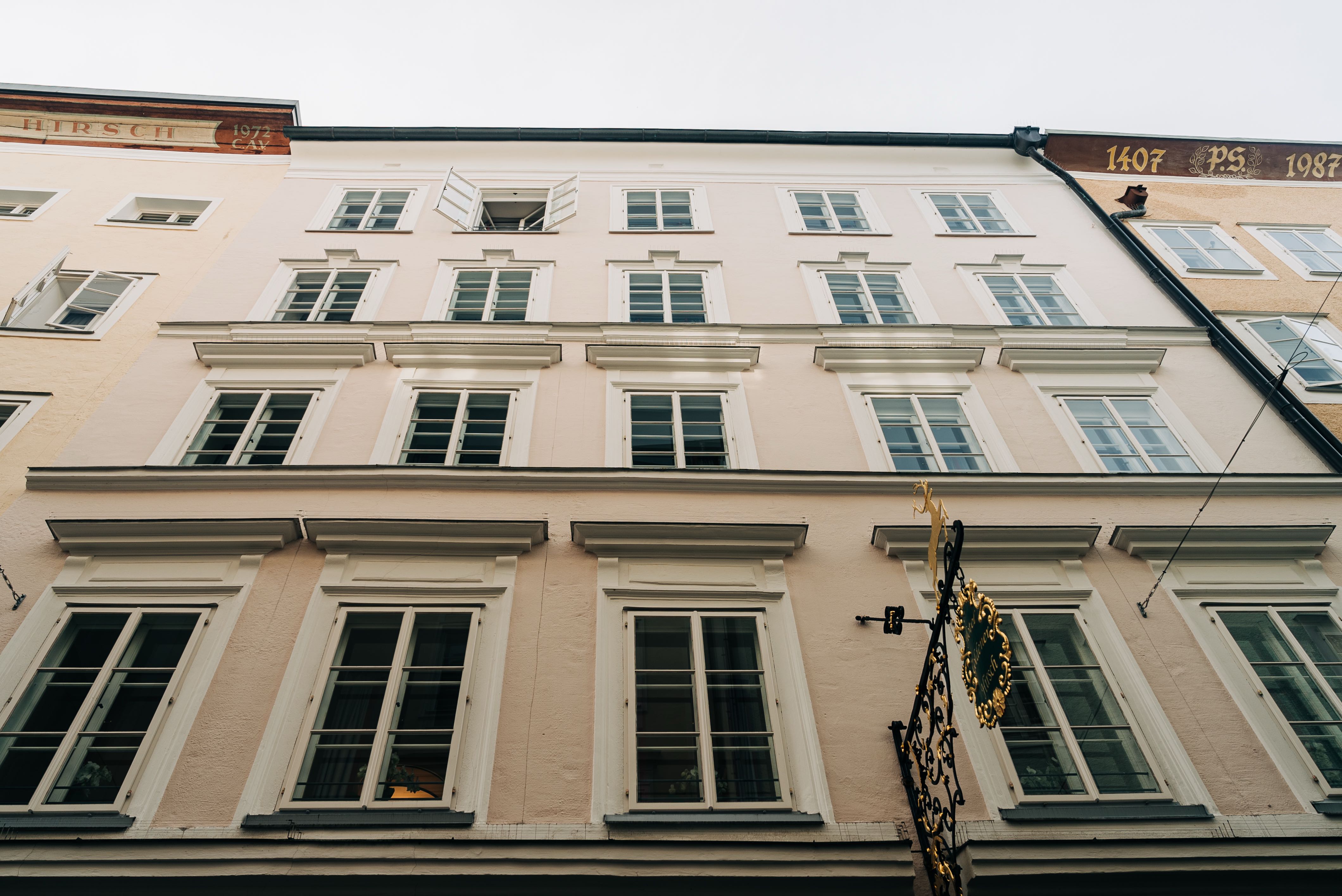 Looking up at the front of the main building of the Hotel Goldener Hirsch, Salzburg