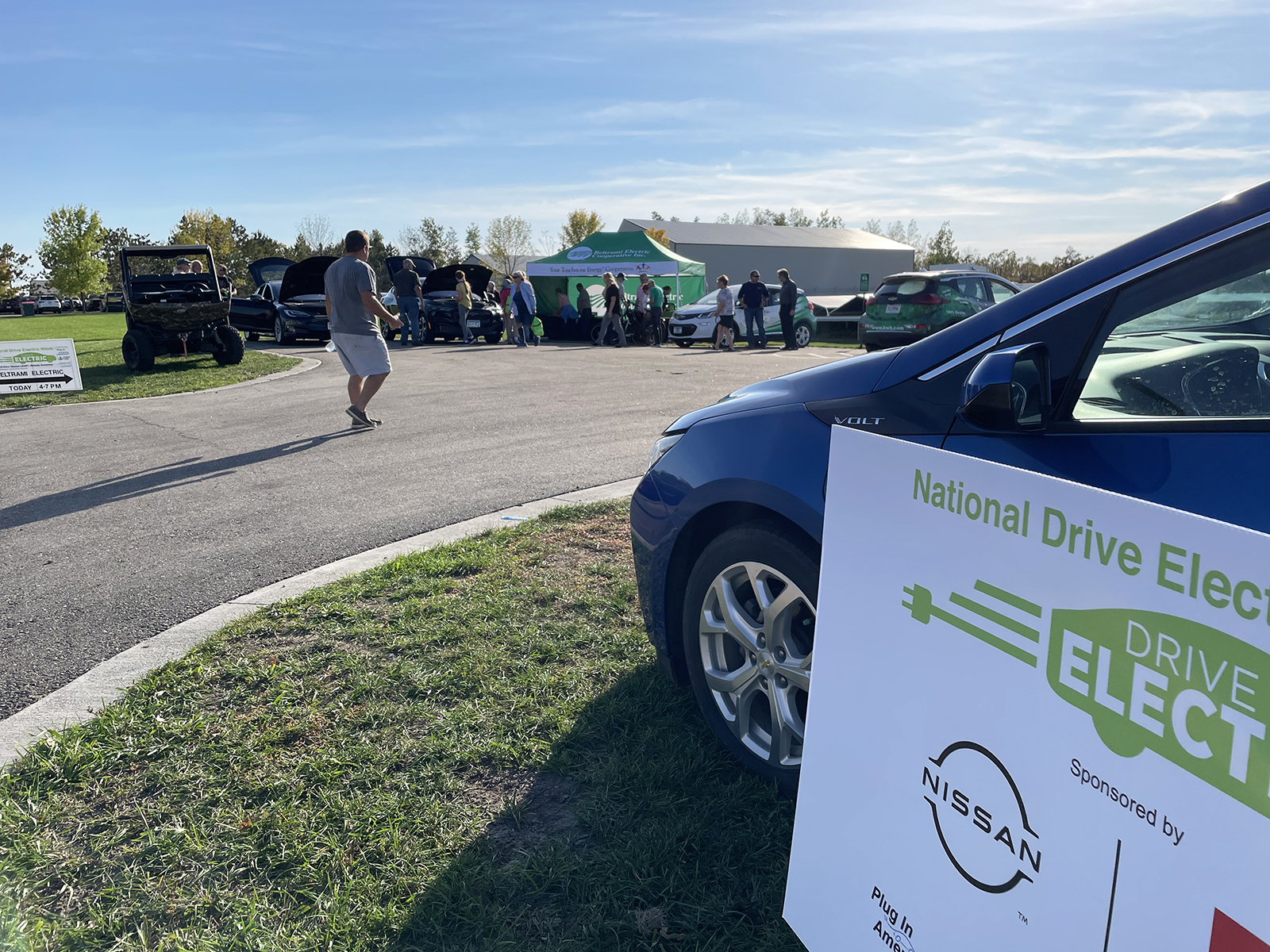 A road showing an electric vehicle for National Drive Electric Week in Roseau, Minnesota.