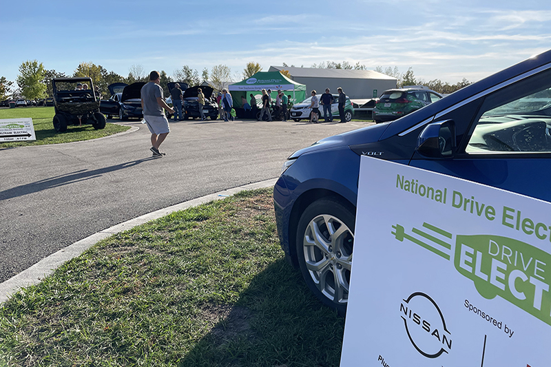 A road showing an electric vehicle for National Drive Electric Week in Roseau, Minnesota.