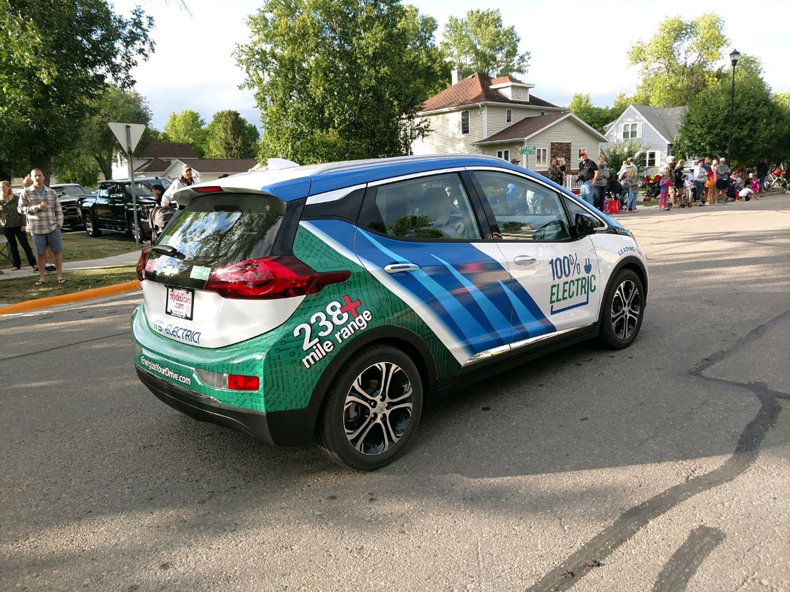 The Minnkota Bolt electric vehicle driving on a residential street