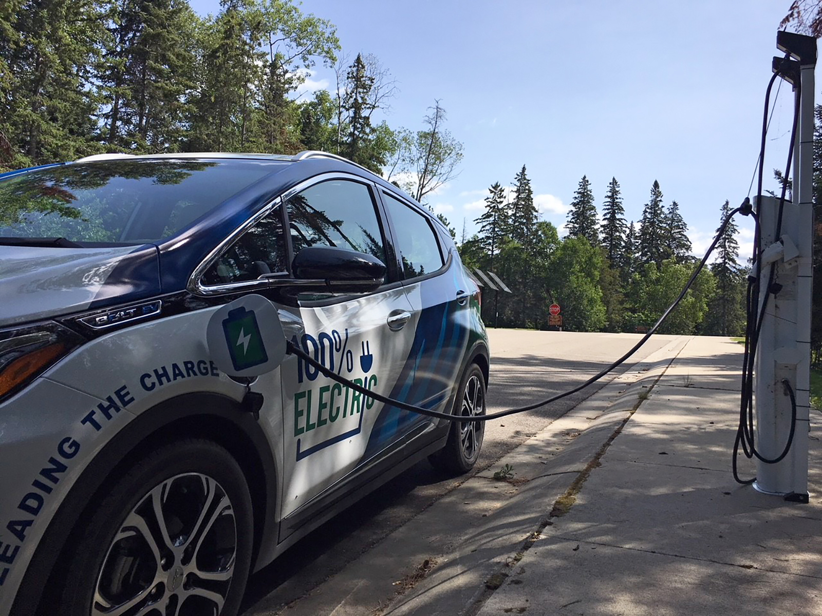 Close up of Minnkota's Bolt electric vehicle at a charging station