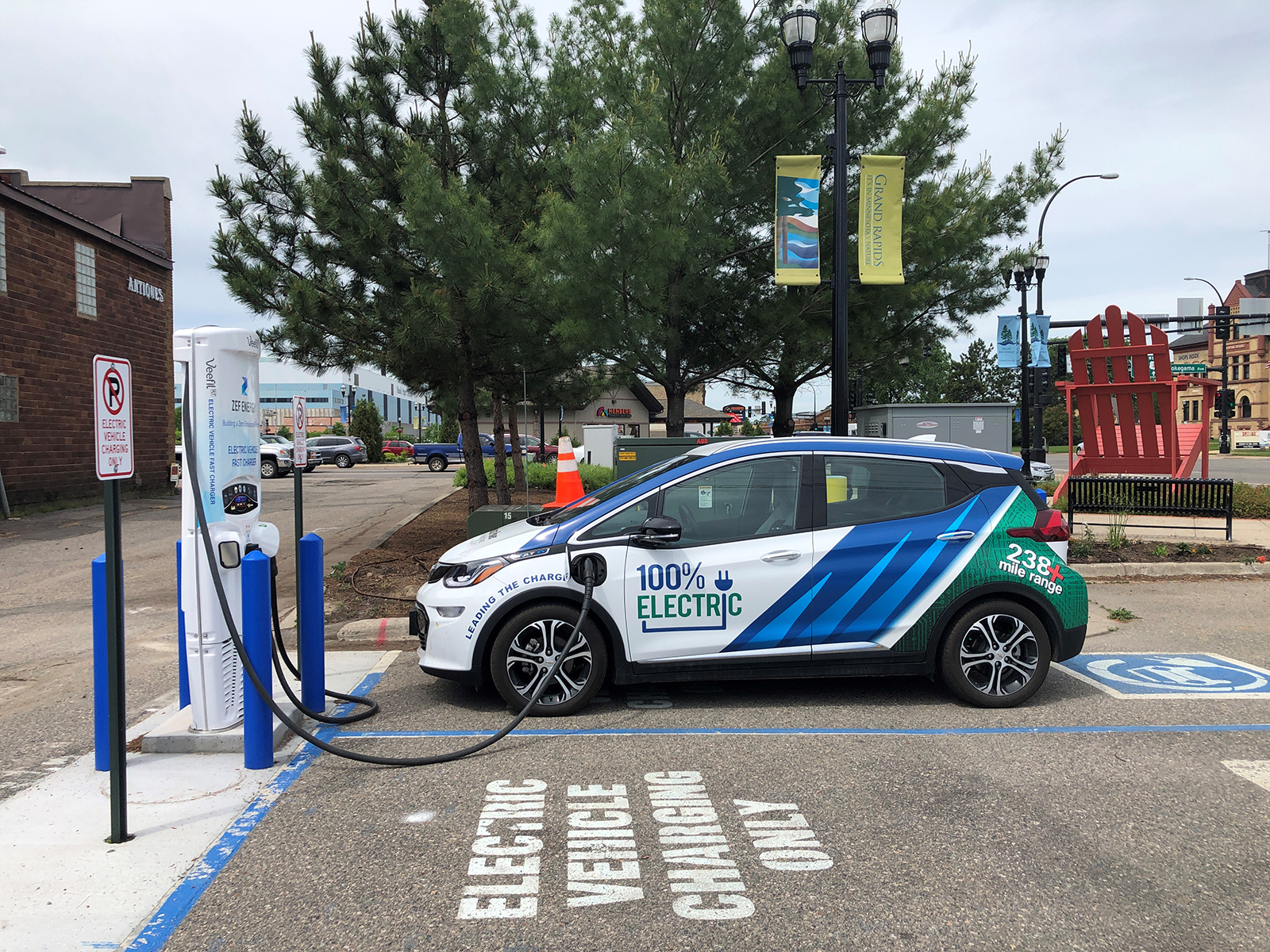 The Minnkota Bolt electric vehicle parked at a charging station in Grand Rapids, Minnesota.