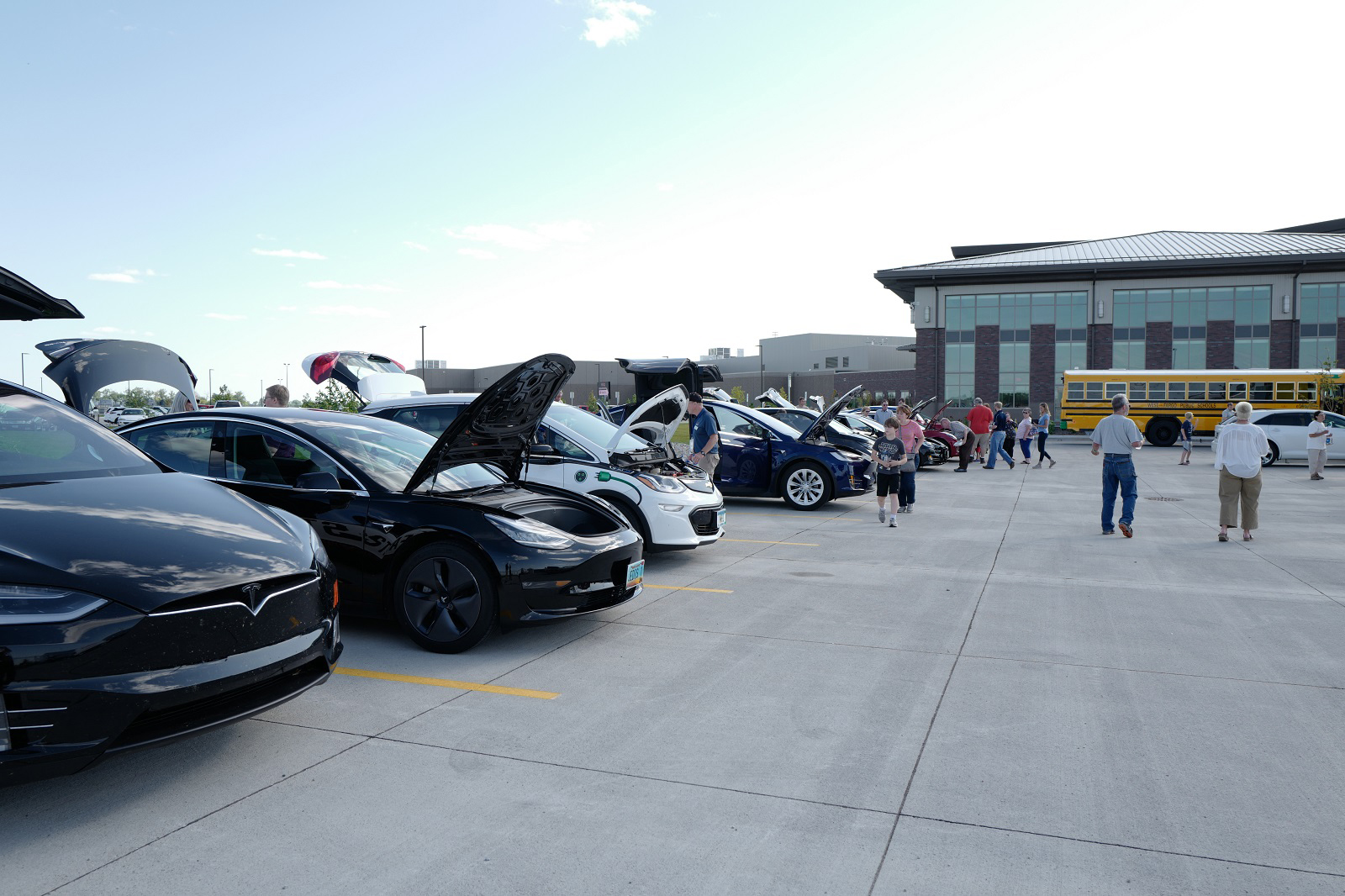 A community event in Minnkota's parking lot celebrating electric vehicles in Grand Forks, North Dakota.
