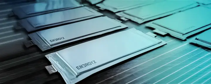 Multiple flat, silver-colored battery cells with "ENERGYX" logo arranged on a surface.