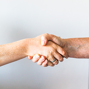 Two people holding hands