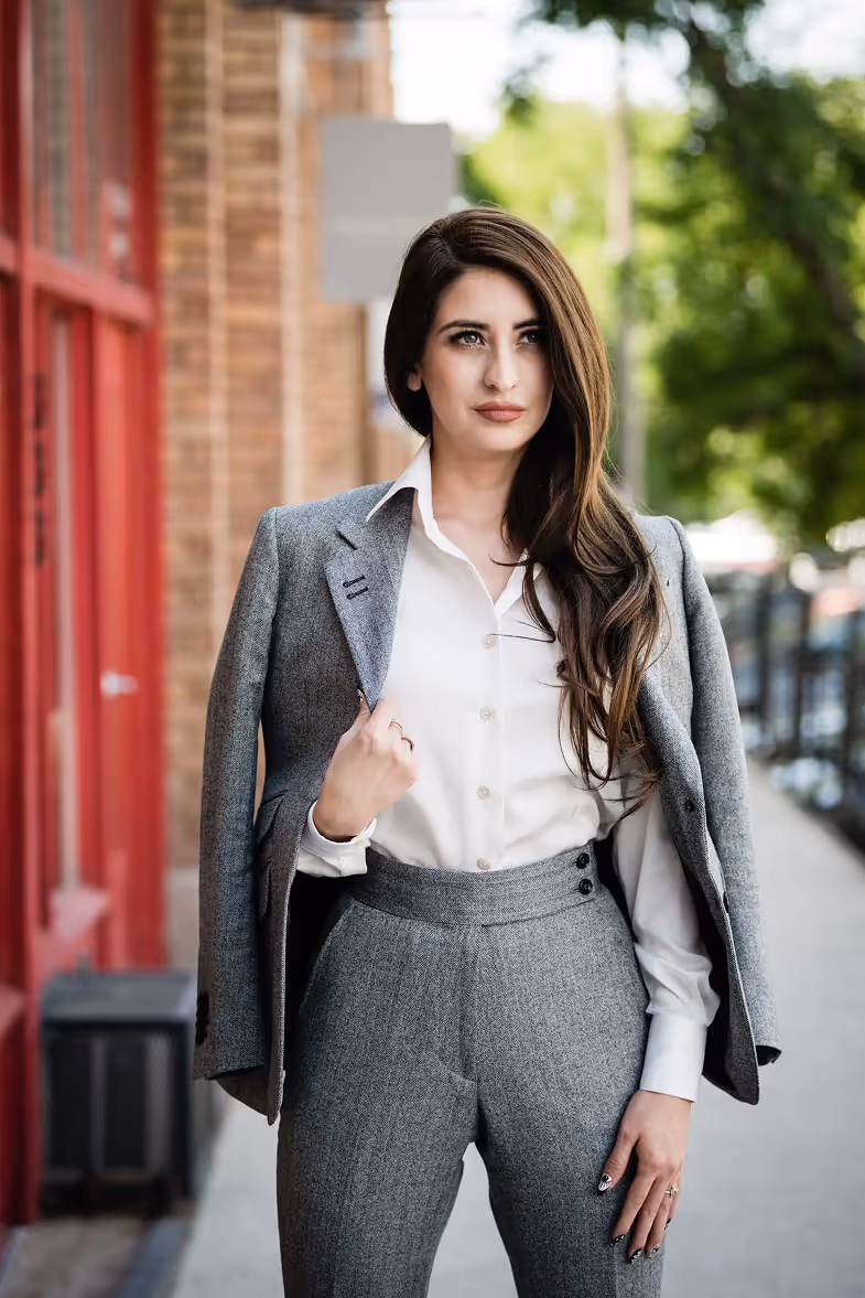 model standing outside with suit jacket