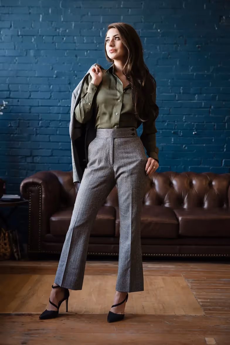 model standing with suit jacket over her shoulder