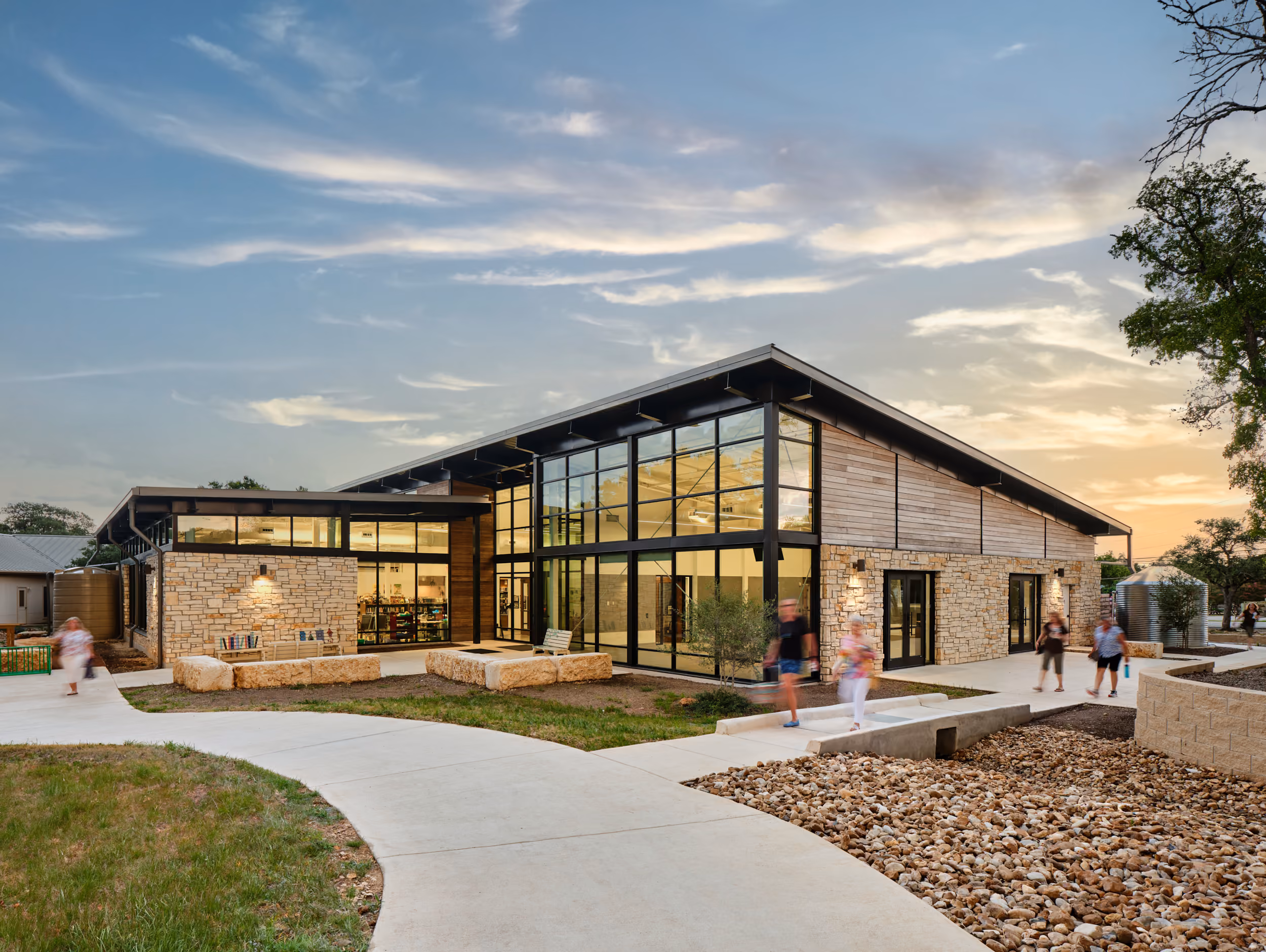 Wimberly Village Library: exterior at sunset