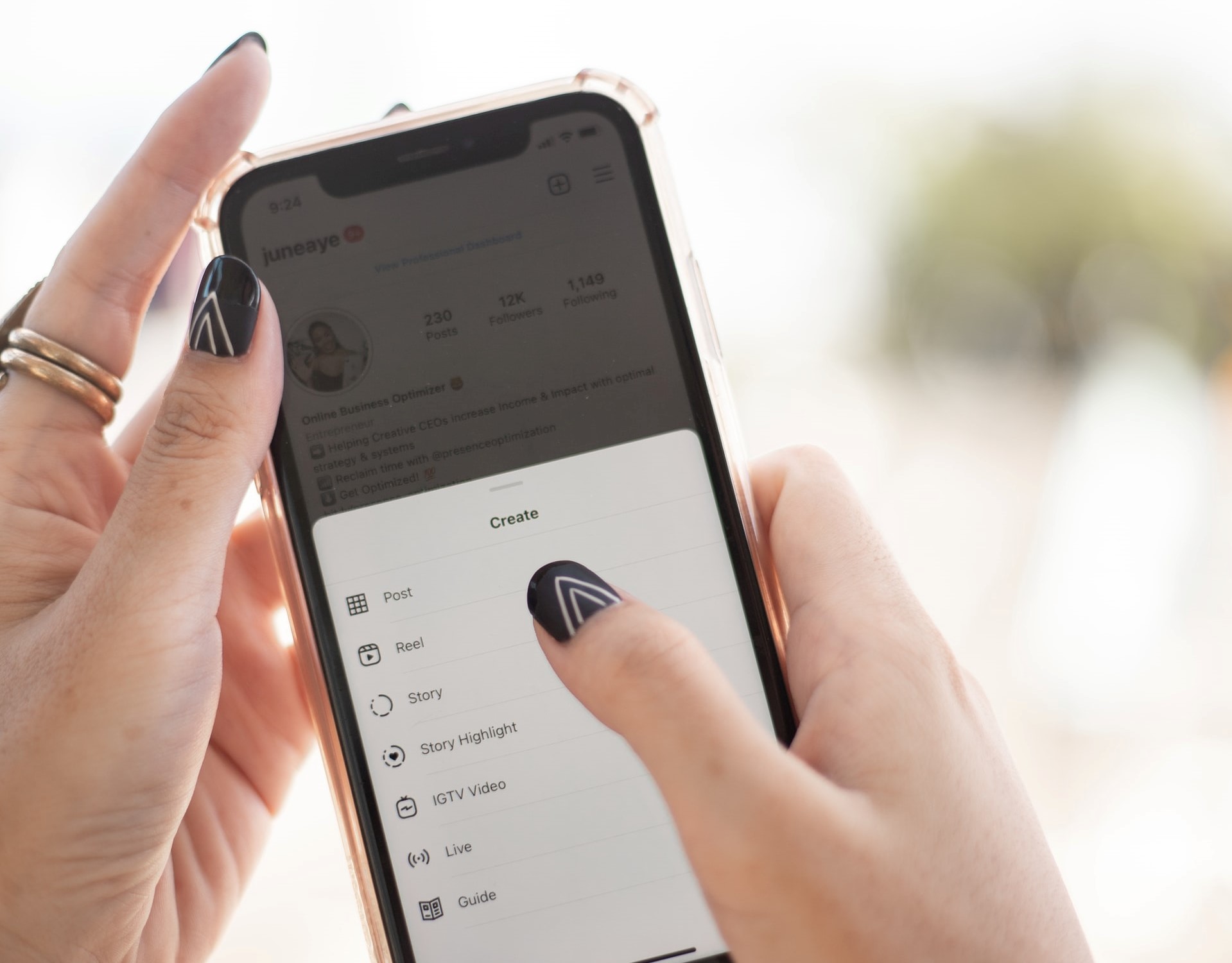 woman with black painted nails on the create page of Instagram