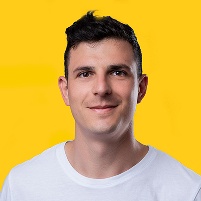 A professional headshot of Stefano