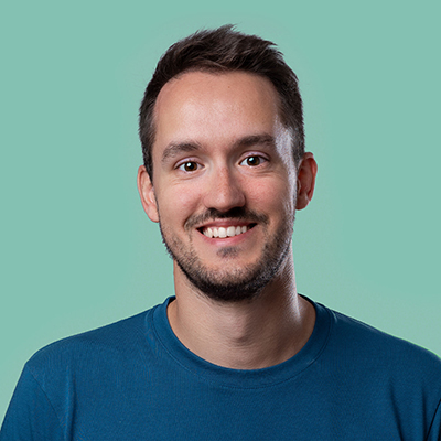A professional headshot of Paolo