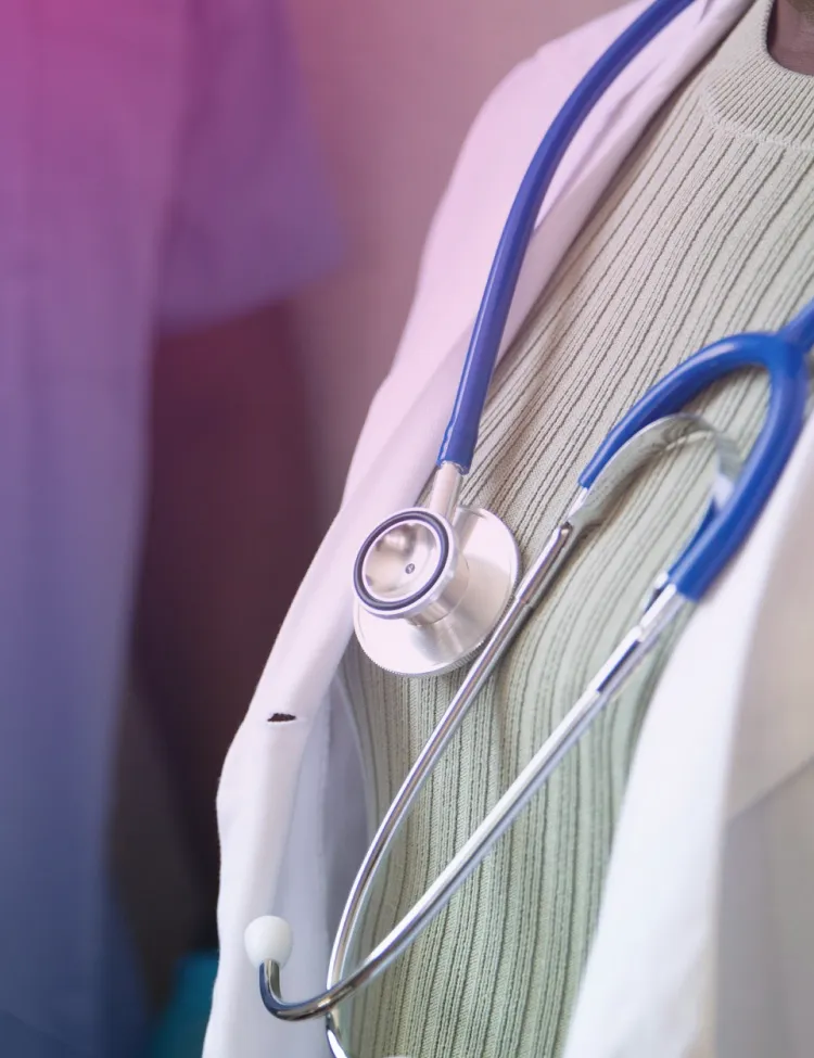 Clinician in a white coat with a stethoscope