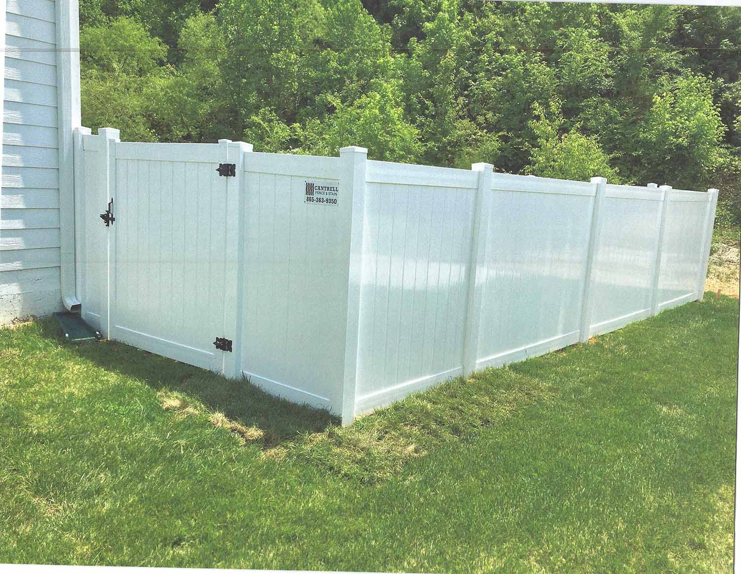 White vinyl privacy fence installed by Cantrell Fence & Stain