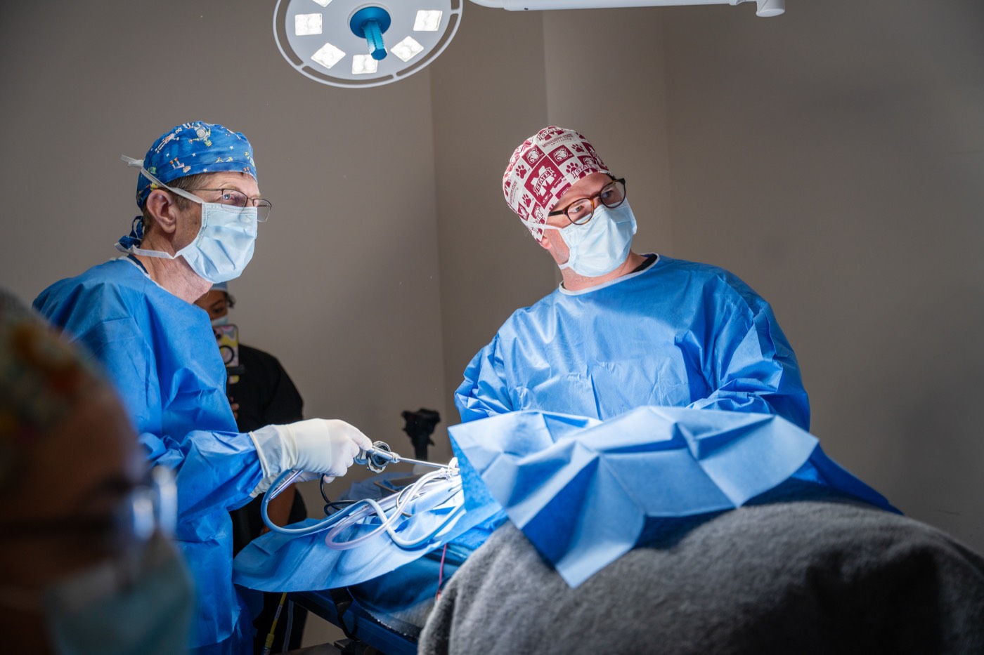 A Sploot veterinary surgical team performing a procedure in a sterile surgical suite