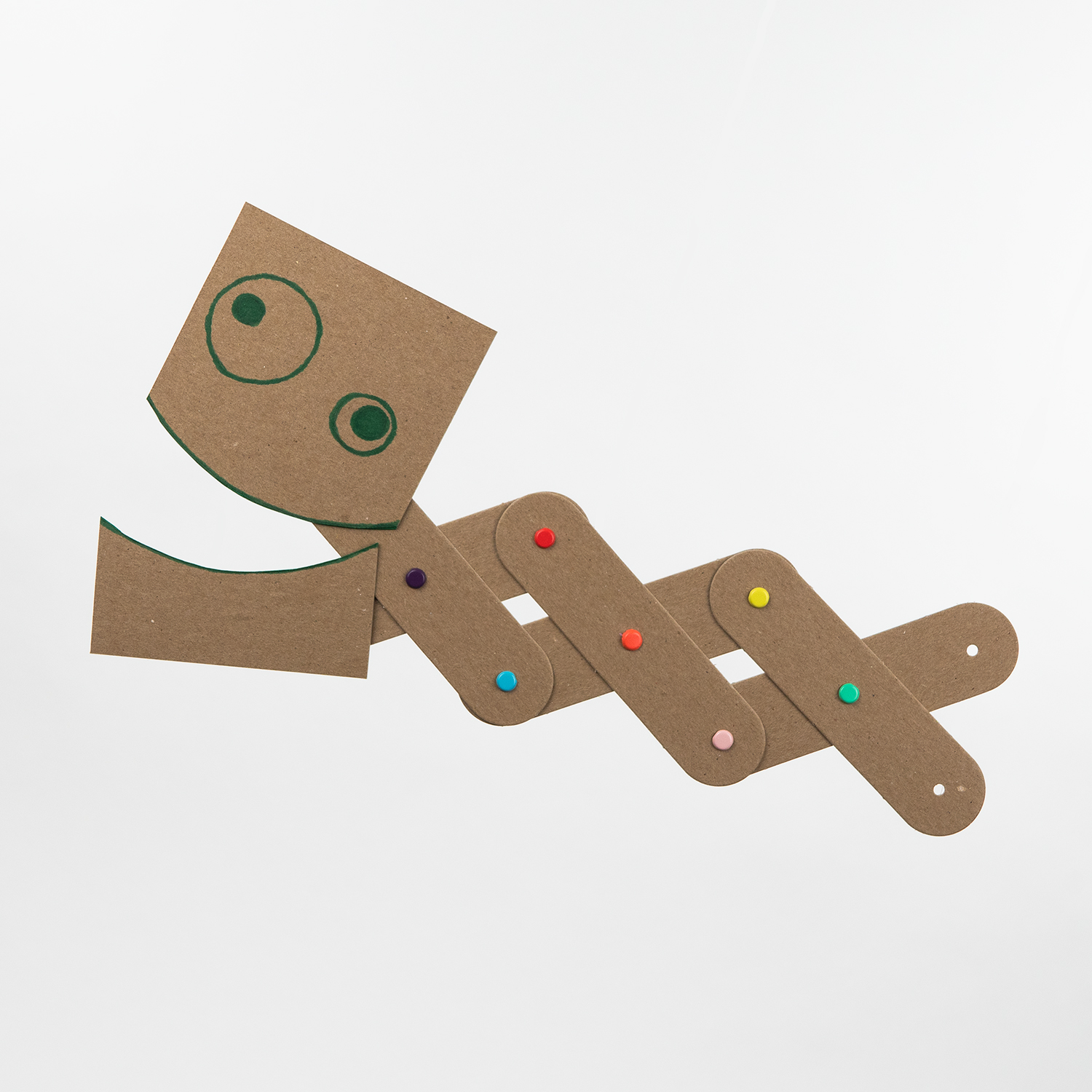 A finished Art Machines cardboard creature with colorful fasteners