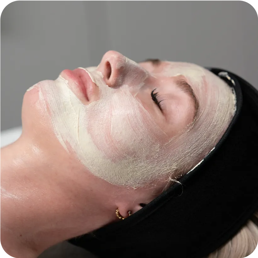 A fair skinned woman relaxing during her Resurfacing Chemical Peel from her local Restore