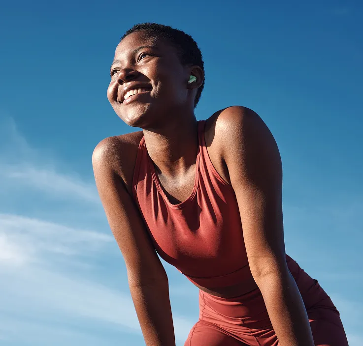 Woman in athletic gear smiling