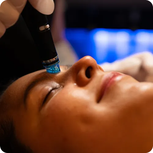 woman receiving Hydrafacial 